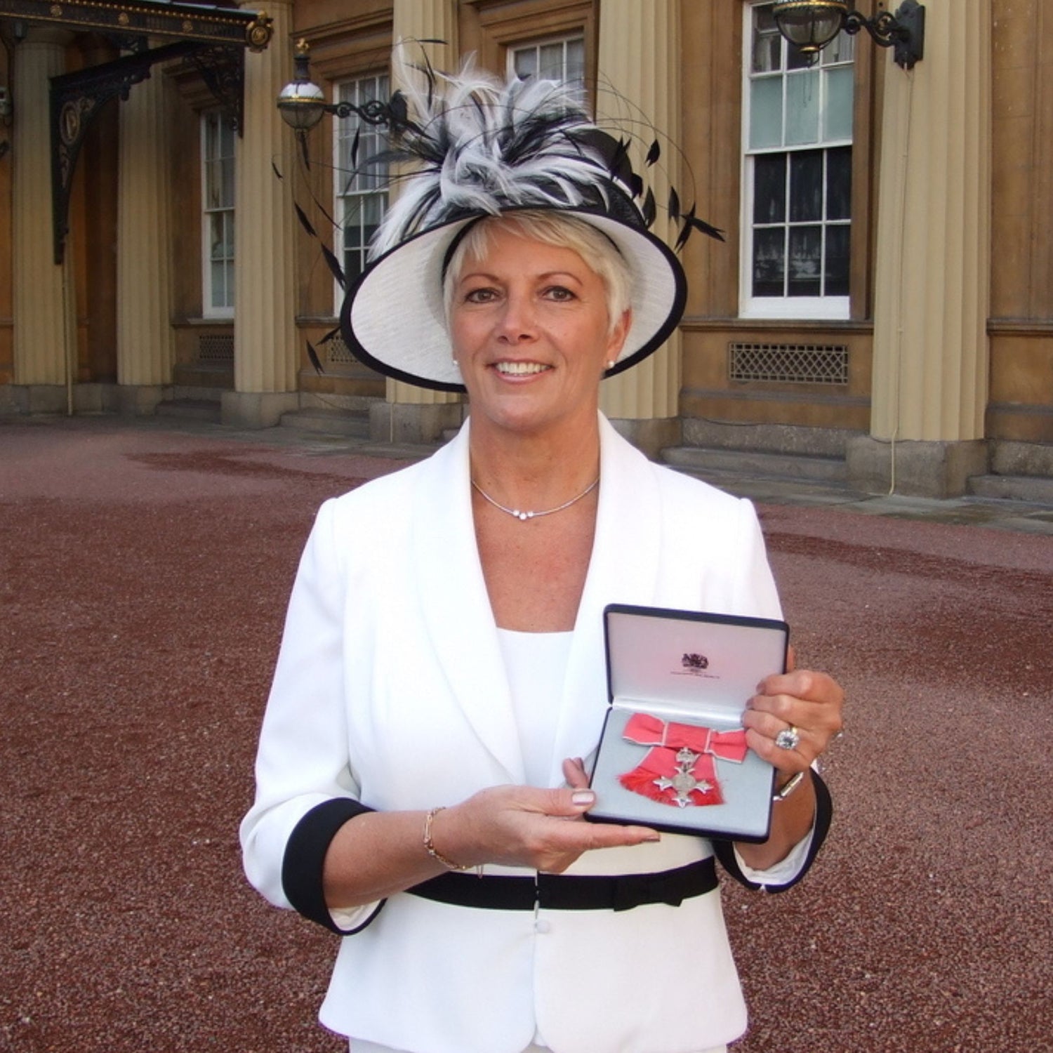 Anita recieving MBE for her services